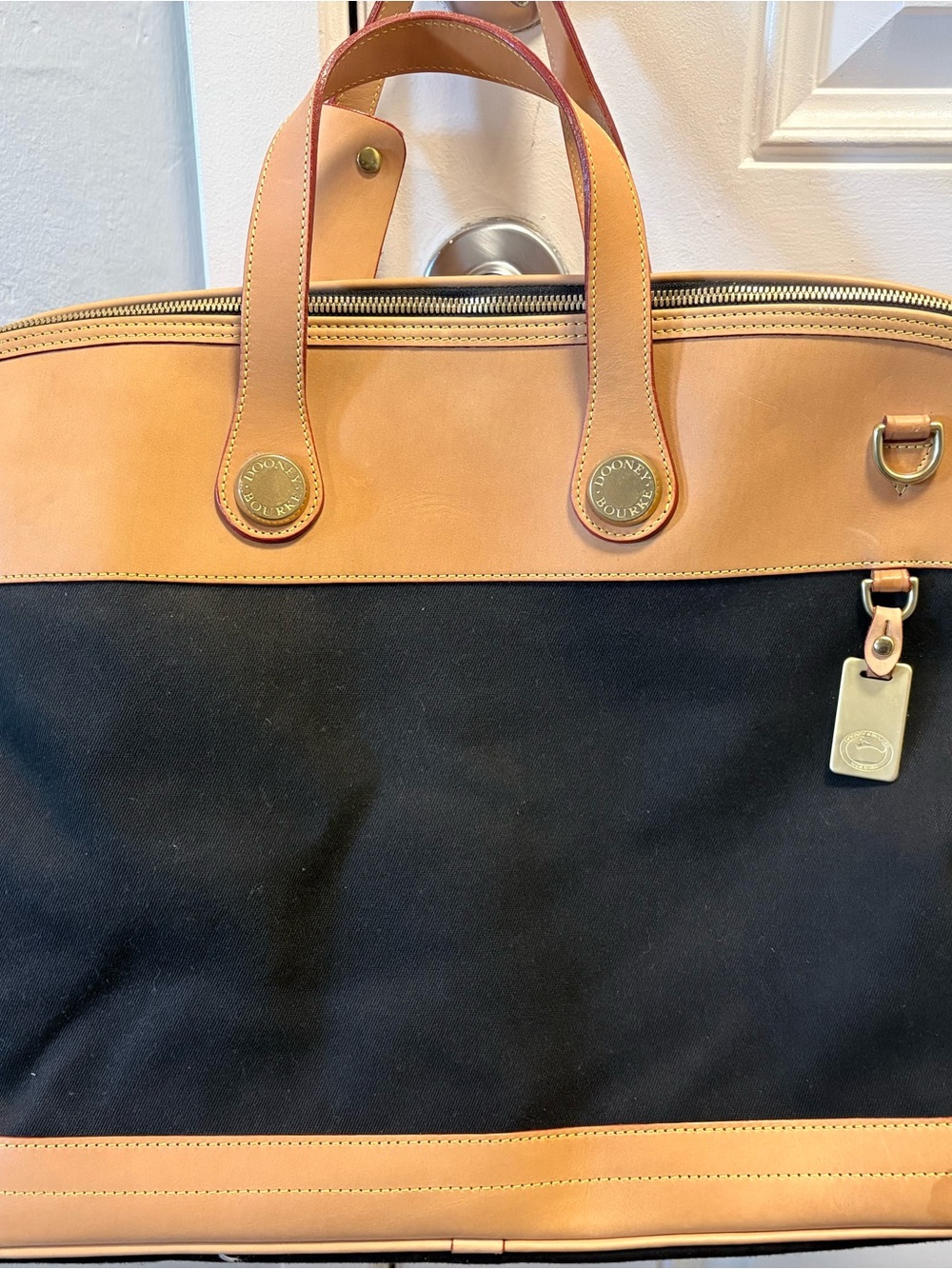 Dooney & Bourke Black and Tan Leather-Trim Weekender Bag. Size: 21.5 x 13.5